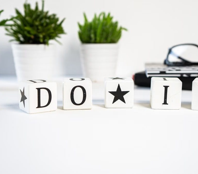 Inspiring office scene with 'Do It' blocks and plants, perfect for motivation.